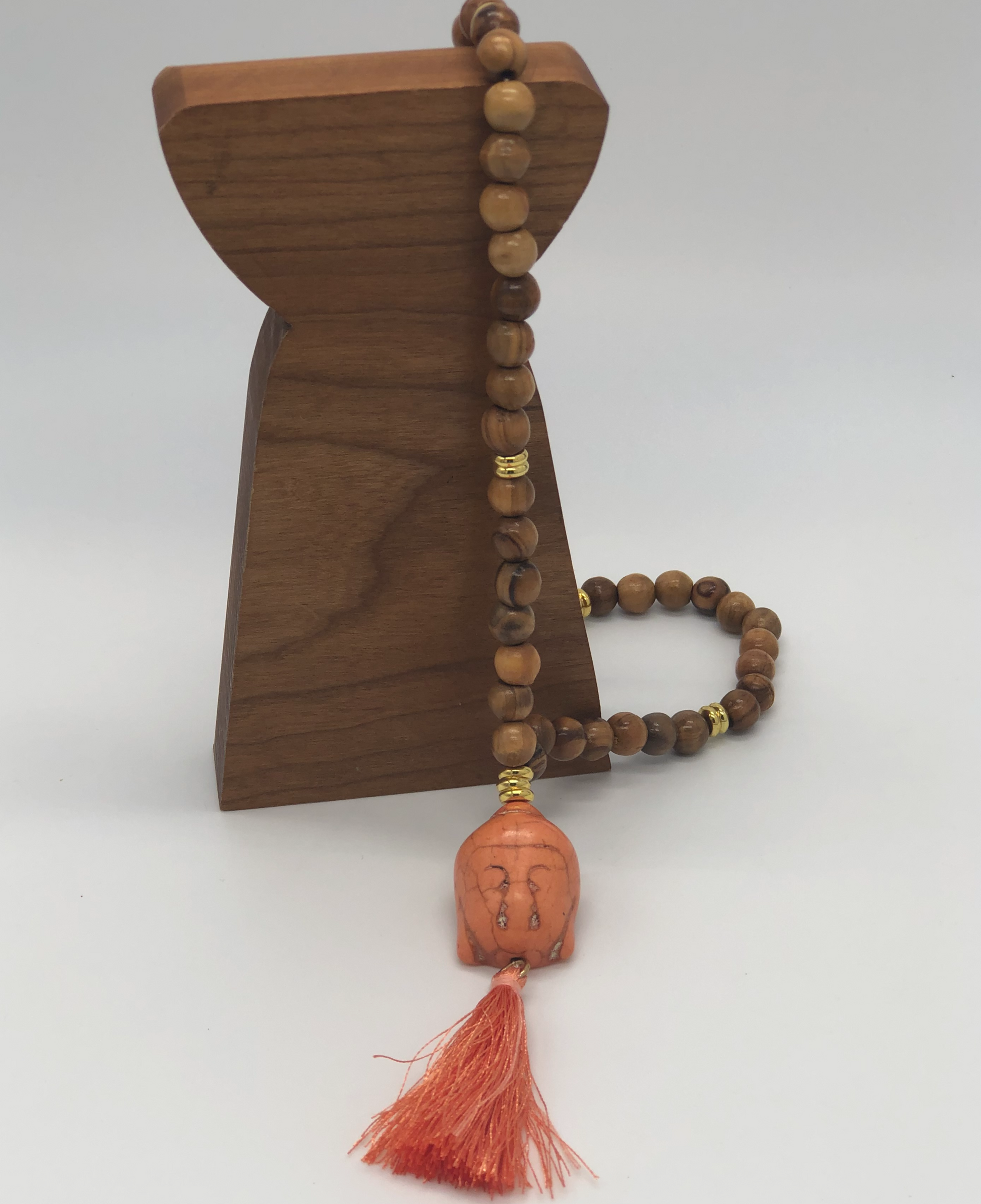 Orange Buddha head and orange tassel  beads