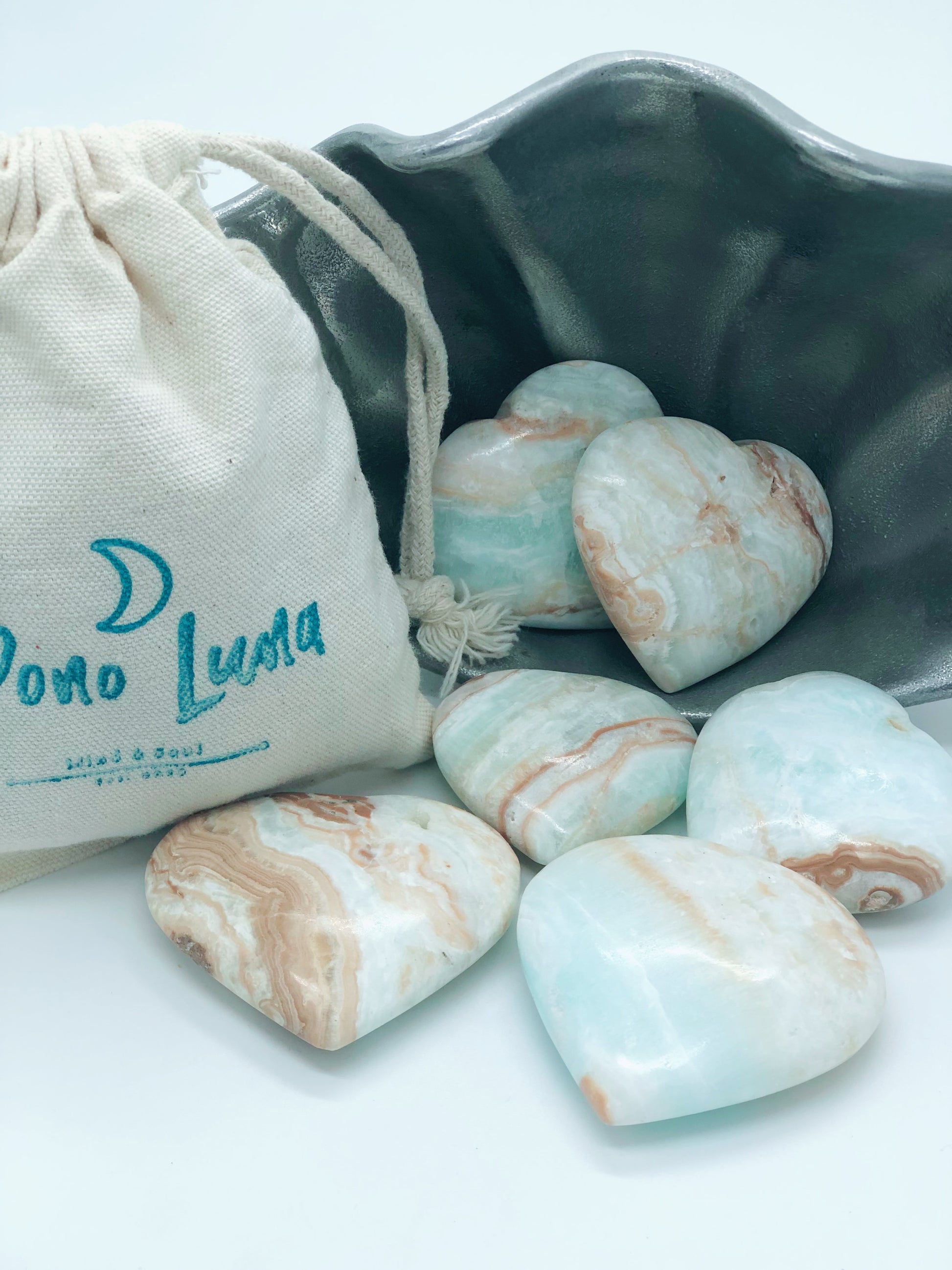 Pono Luna’s beautiful hand carved heart shaped Caribbean Calcite stones. 